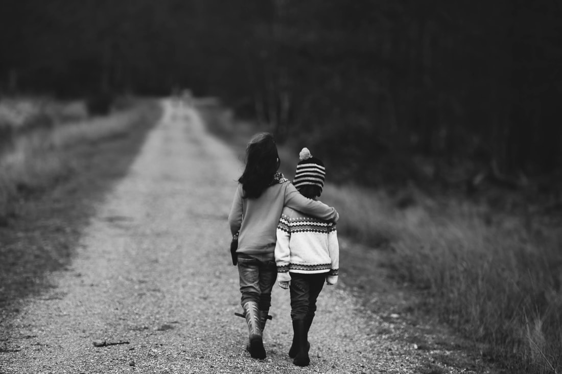 Children Walking a Path and embracing - Forgiveness and Friendship