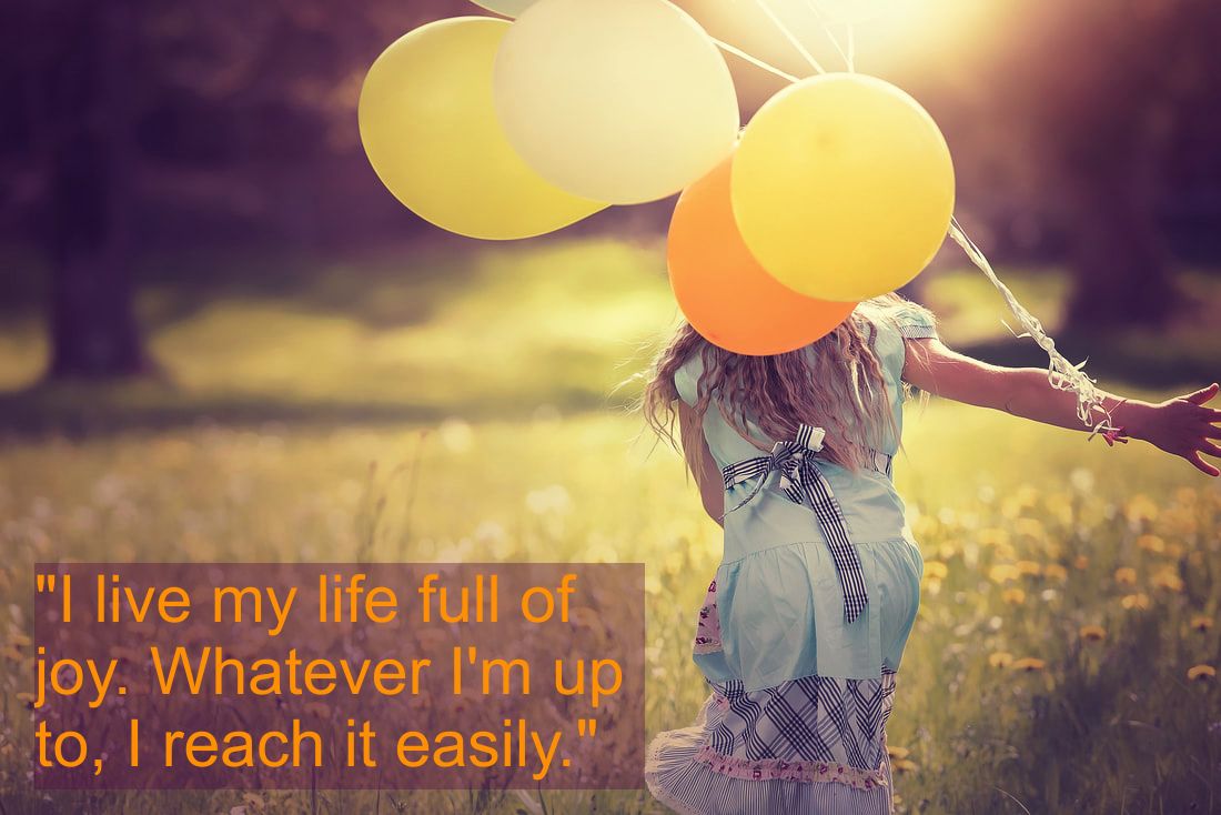 Happy andjoyful girl in a flower meadow with balloons and Spiritual Affirmation: 