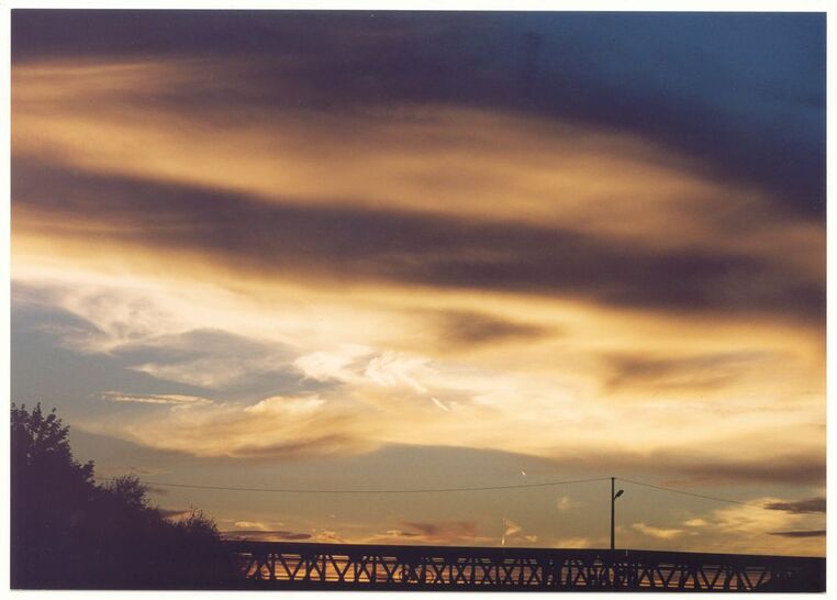 Sunset over Bridge - The angels ask you to finally remove the ballast that you are carrying with you